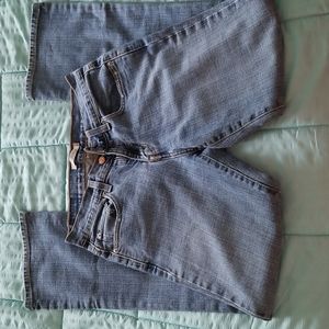 Mid Rise Women's Boot cut Jeans: Sits at Wais